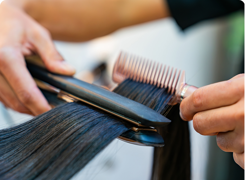 Professional hair straightening process close-up