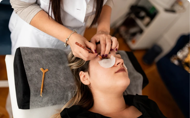 Eyelash extension procedure in progress
