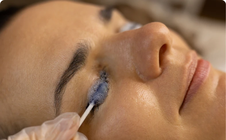 Eye treatment with blue cosmetic cream