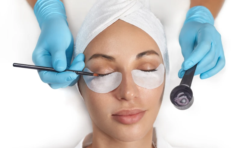 Beauty therapy session with eye pads